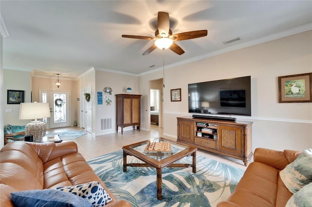 living area with light tile patterned floors, visible vents, and ornamental molding