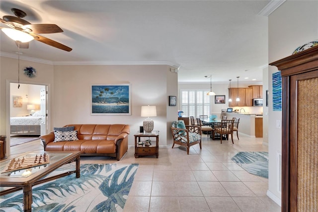 living room with ceiling fan, light tile patterned flooring, and crown molding