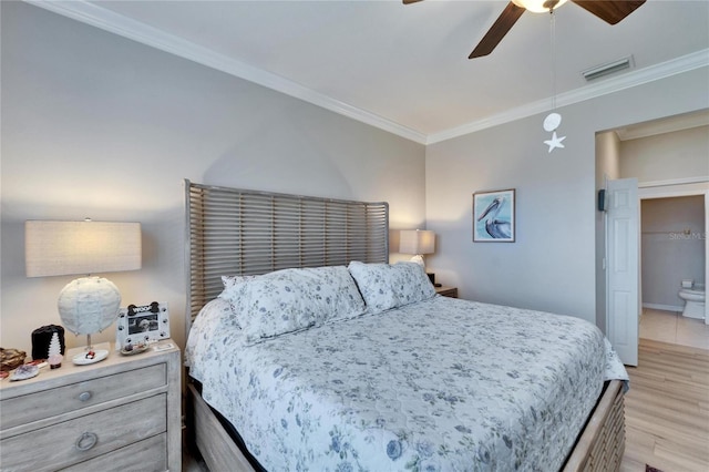 bedroom with light wood finished floors, visible vents, a ceiling fan, and ornamental molding