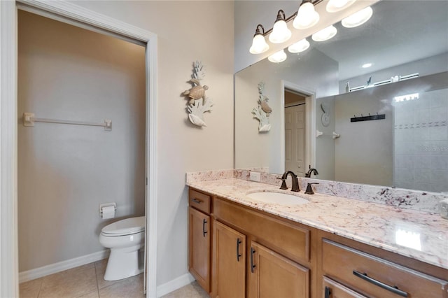 full bath featuring tile patterned flooring, toilet, vanity, and baseboards