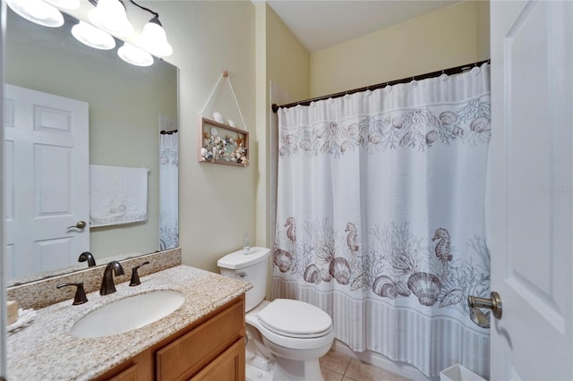 bathroom with tile patterned floors, toilet, vanity, and a shower with curtain