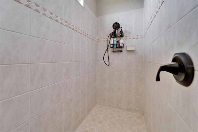 full bath with tiled shower