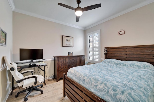 bedroom featuring light wood finished floors, ceiling fan, and ornamental molding