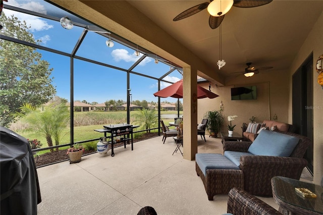 view of patio / terrace featuring grilling area, outdoor lounge area, a lanai, and a ceiling fan