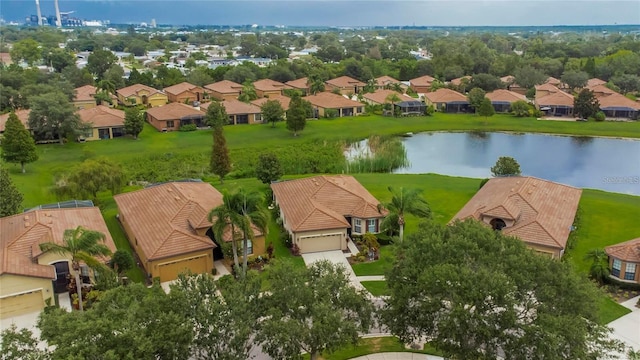 birds eye view of property with a residential view and a water view