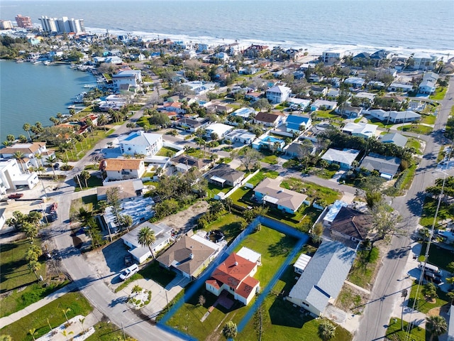 birds eye view of property with a water view and a residential view