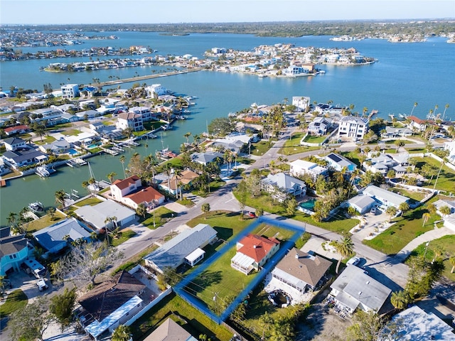 bird's eye view featuring a residential view and a water view