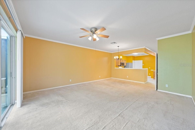 unfurnished living room with light carpet, crown molding, baseboards, and ceiling fan with notable chandelier