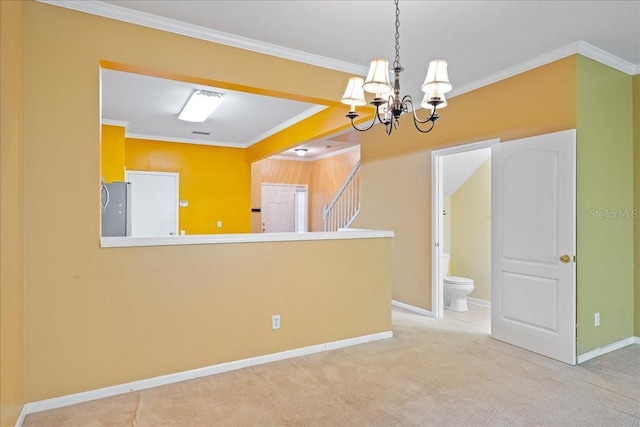 spare room featuring carpet, baseboards, and crown molding