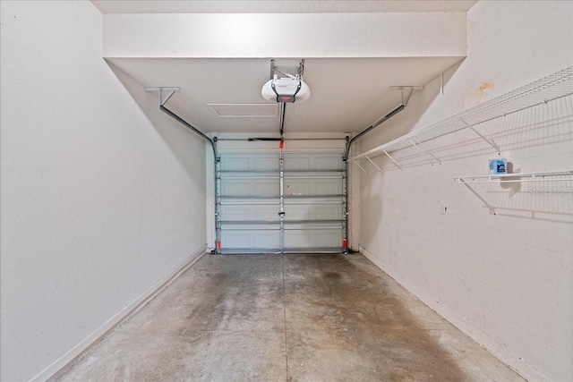 garage featuring baseboards and a garage door opener