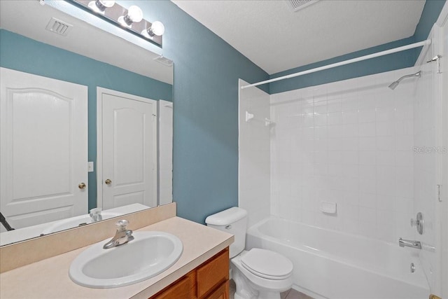 full bath with visible vents, shower / bath combination, toilet, vanity, and a textured ceiling