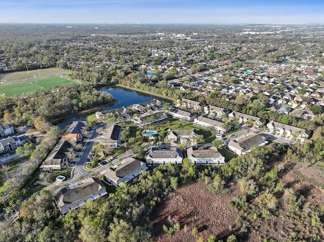 bird's eye view featuring a water view and a residential view