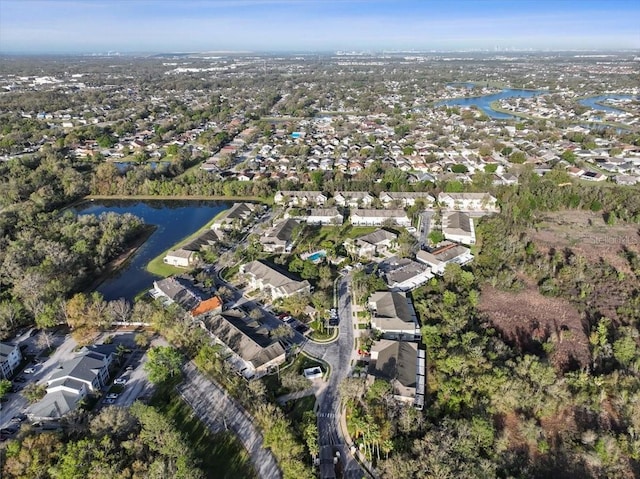 birds eye view of property with a residential view and a water view