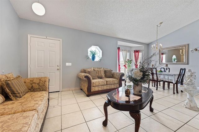 living room featuring a textured ceiling, vaulted ceiling, light tile patterned floors, and a chandelier