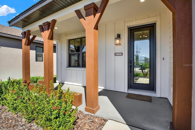 property entrance with a porch and board and batten siding