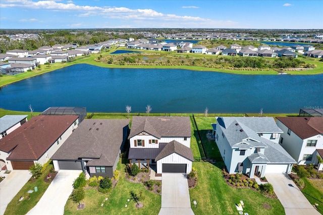 bird's eye view with a residential view and a water view