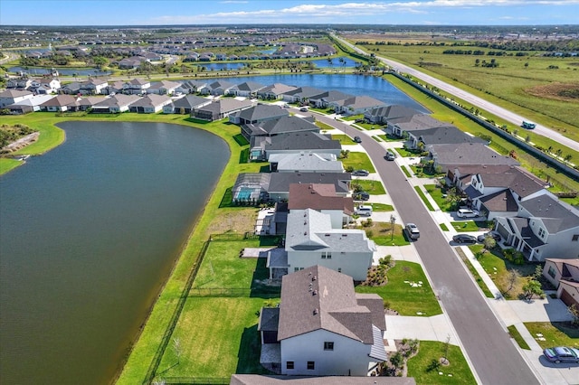 aerial view with a residential view and a water view