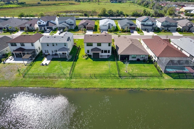 aerial view with a residential view and a water view