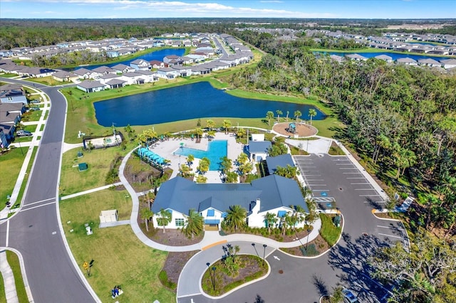 birds eye view of property with a residential view and a water view