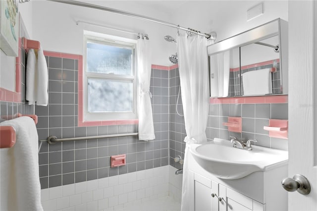 bathroom with vanity, backsplash, tile walls, and a shower with shower curtain