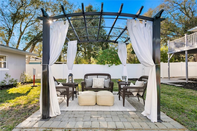 view of patio featuring a fenced backyard, an outdoor living space, and a pergola