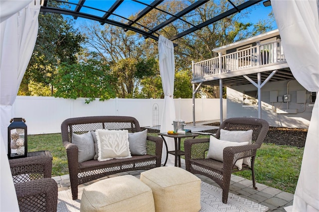 view of patio / terrace featuring an outdoor hangout area, a fenced backyard, and a pergola