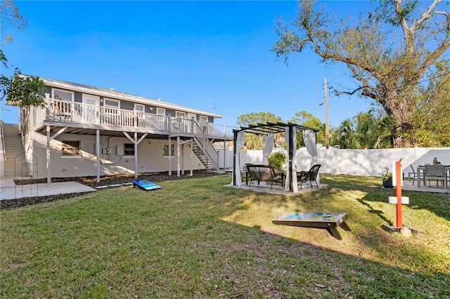 view of yard with a patio, stairway, fence, and a wooden deck