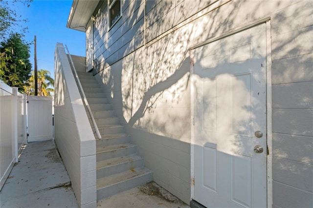 view of side of property featuring a gate and fence