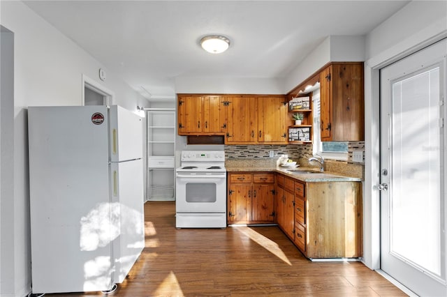 kitchen with white appliances, dark wood-type flooring, decorative backsplash, open shelves, and brown cabinetry