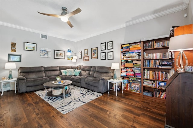 living room featuring ornamental molding, a ceiling fan, visible vents, and hardwood / wood-style flooring