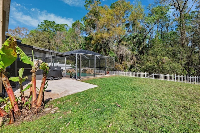 view of yard featuring a patio area, a fenced backyard, a fenced in pool, and a lanai