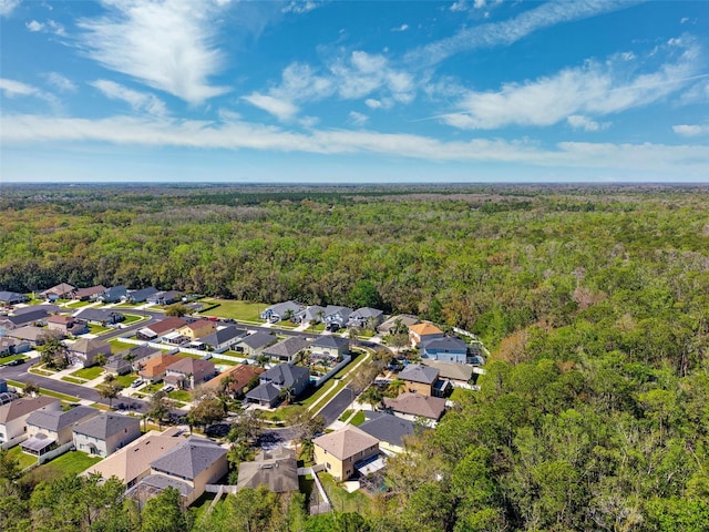 aerial view featuring a residential view and a forest view