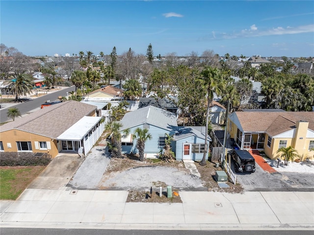 birds eye view of property with a residential view