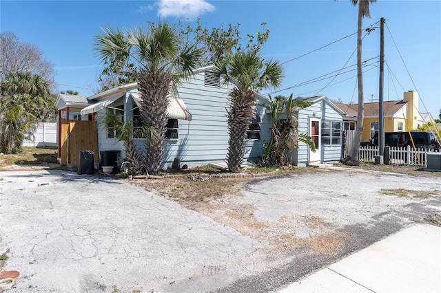 view of front of home featuring fence