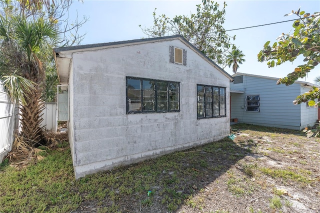 view of home's exterior with fence