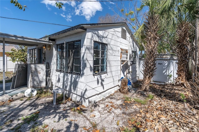 view of property exterior featuring fence