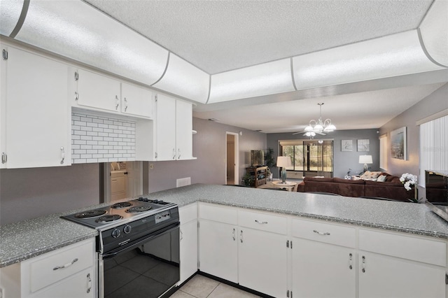 kitchen with light tile patterned floors, a chandelier, black / electric stove, white cabinetry, and open floor plan