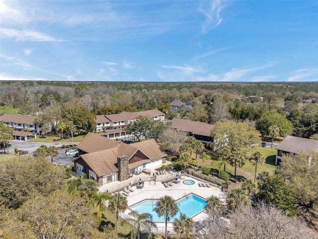 aerial view with a wooded view and a residential view