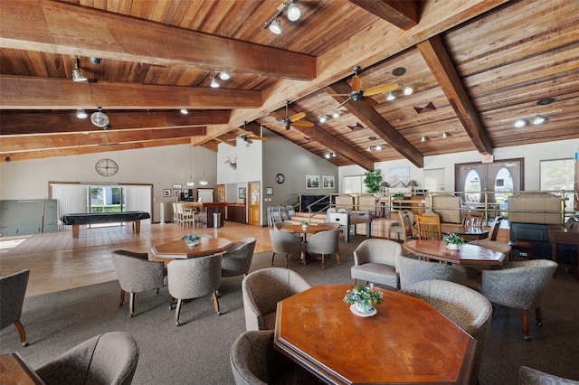 dining area featuring ceiling fan, high vaulted ceiling, wood ceiling, french doors, and beam ceiling