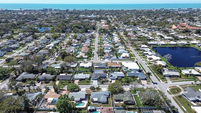 bird's eye view with a residential view and a water view