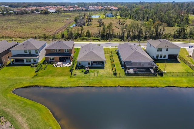 bird's eye view featuring a water view and a residential view