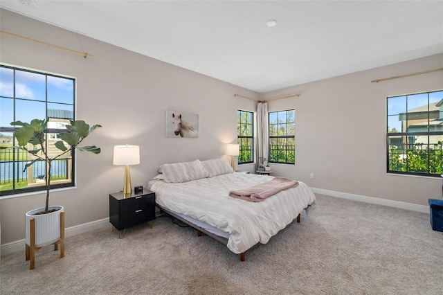 carpeted bedroom with baseboards