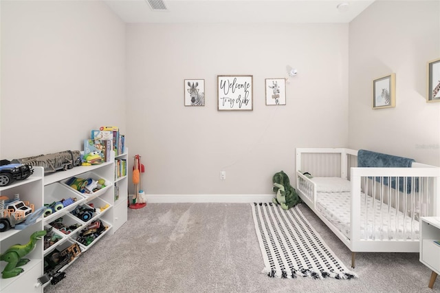 carpeted bedroom featuring visible vents and baseboards