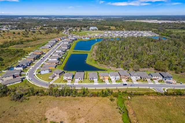 drone / aerial view featuring a water view and a residential view