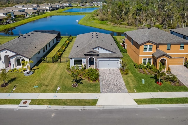 birds eye view of property featuring a water view and a residential view