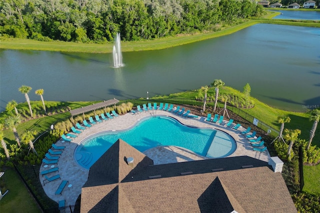 view of pool with a water view