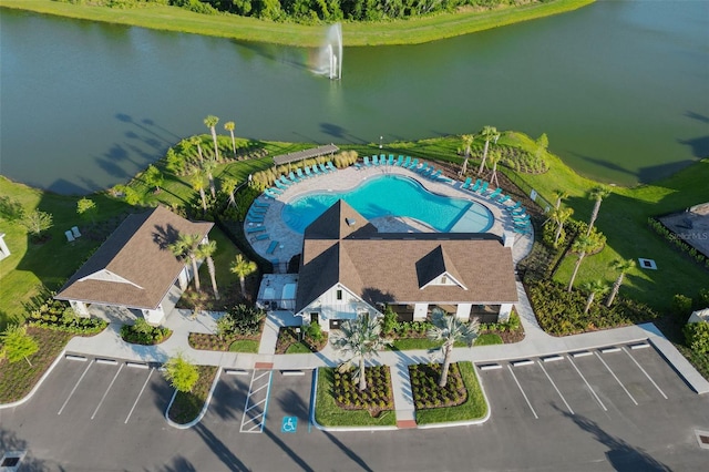 birds eye view of property with a water view