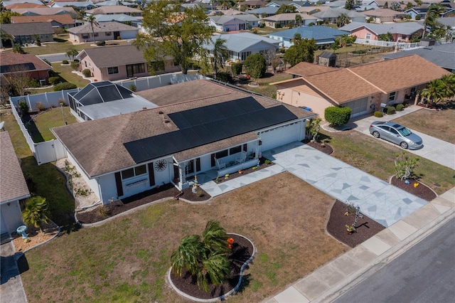 birds eye view of property with a residential view