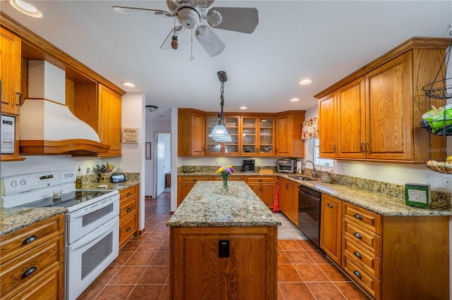 kitchen featuring white appliances, a sink, a center island, brown cabinetry, and custom range hood