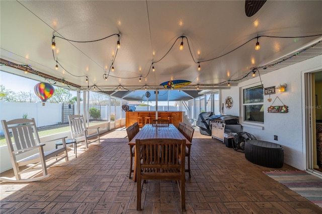 view of patio featuring grilling area and fence